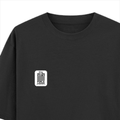 Oversized Standard T-Shirt | Unisex Oversized Fit | 180 GSM 100% Super Combed Cotton | DTF Print | Soft & Durable | Personalized | DTF | Typography-focused | Trust | Friendship | Reassuring - left pocket - Black - mockup 3