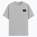 Basic T-Shirt | Unisex Fit XS-2XL | Poly-Cotton Blend Soft Finish | Durable Stitching Lycra Rib Neck | Adults | Personalized | DTG | Bold | Rebellion | Defiance | Everyday | Defiant - left pocket - Grey Melange - mockup 3