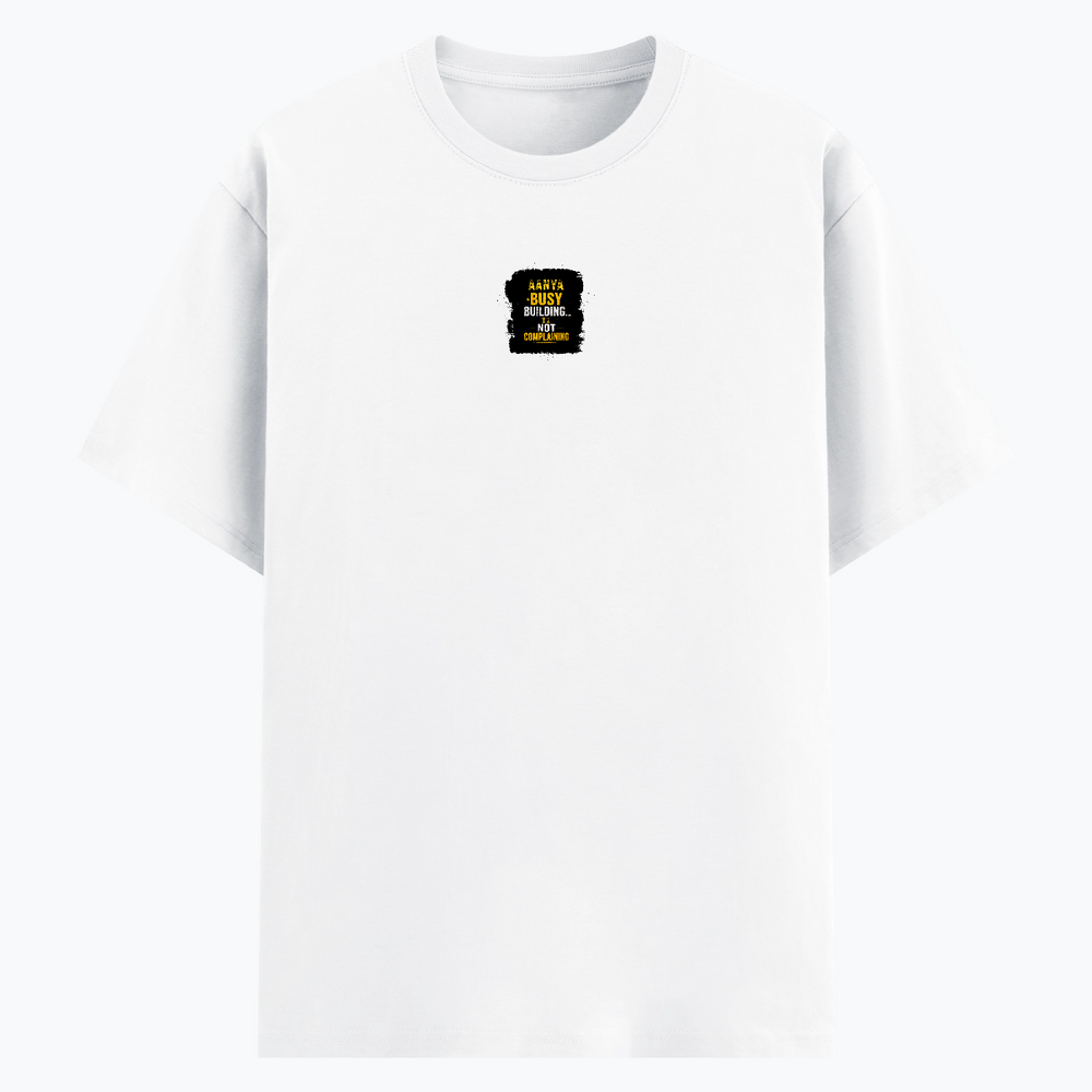 Basic T-Shirt | Unisex Fit, Sizes XS-2XL | 180 GSM Poly-Cotton Blend, DTF Ready | Bio-Wash, Silicon Finish, Durable Stitching | Adults | Personalized | DTF | Typographic | Work Ethic | Success | Everyday | Motivational | Busy Building, Not Complaining - front - White - mockup 1