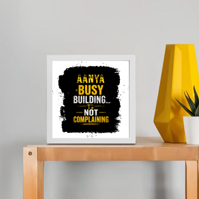 Framed Poster | Multiple Sizes & Frame Colors | 300 GSM Art Paper, Laminated | Fade-Proof Digital Print, Mounting Kit Included | Unisex | Personalized | Typographic | Work Ethic | Success | Everyday | Motivational | Busy Building, Not Complaining - front_8x8In - 8x8In - mockup 1