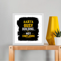 Framed Poster | Multiple Sizes & Frame Colors | 300 GSM Art Paper, Laminated | Fade-Proof Digital Print, Mounting Kit Included | Unisex | Personalized | Typographic | Work Ethic | Success | Everyday | Motivational | Busy Building, Not Complaining - front_10x10In - 10x10In - mockup 3