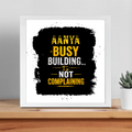 Framed Poster | Multiple Sizes & Frame Colors | 300 GSM Art Paper, Laminated | Fade-Proof Digital Print, Mounting Kit Included | Unisex | Personalized | Typographic | Work Ethic | Success | Everyday | Motivational | Busy Building, Not Complaining - front_14x14In - 14x14In - mockup 9