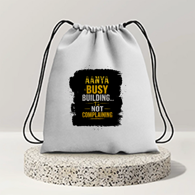 Drawstring Bag | Unisex | 280 GSM Cotton DTF | Durable, Secure Closure, Versatile | Everyday Carry | Personalized | DTF | Typographic | Work Ethic | Success | Everyday | Motivational | Busy Building, Not Complaining - front - mockup 1