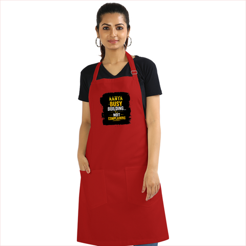 Apron | Onesize Unisex Adult | Cotton DTG Printed | Pockets & Adjustable Straps | Personalized | DTG | Typographic | Work Ethic | Success | Everyday | Motivational | Busy Building, Not Complaining - front - Red - mockup 1
