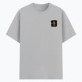 Basic T-Shirt | Unisex XS-2XL | Poly-Cotton Blend | Soft Finish, Durable Stitching | For Him, For Her | Personalized | DTF | Typography | Productivity | Ambition | Everyday | Empowering | Busy Building, Not Complaining - left pocket - Grey Melange - mockup 3