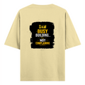 Oversized Standard T-Shirt | Unisex Oversized Fit | 100% Super Combed Cotton DTF Print | Soft, Breathable, Durable | Adults | Personalized | DTF | Typography | Productivity | Ambition | Everyday | Empowering | Busy Building, Not Complaining - back - Beige - mockup 2