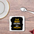 Coasters | Unisex | 3mm MDF Sublimation Print | Durable Surface Protection | All Ages | Personalized | Typography | Productivity | Ambition | Everyday | Empowering | Busy Building, Not Complaining - front_2 - White - mockup 2