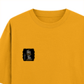 Oversized Classic T-Shirt | Unisex Relaxed Fit | 100% Super-Combed Cotton | Pre-Shrunk, Double-Stitched | Adults | Personalized | Typography | Royalty | Power | Everyday | Empowering | The Crowned Warrior - left pocket - Golden Yellow - mockup 3