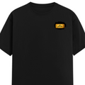 Male Classic Crew T-Shirt | Men's Regular Fit | 180 GSM Bio-Washed Cotton | Pre-Shrunk, Double-Stitched | Personalized | Typography | Bollywood | Movies | Everyday | Confident | Famous By - left pocket - Black - mockup 3