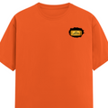 Male Classic Crew T-Shirt | Men's Regular Fit | 180 GSM Bio-Washed Cotton | Pre-Shrunk, Double-Stitched | Personalized | Typography | Bollywood | Movies | Everyday | Confident | Famous By - left pocket - Orange - mockup 3
