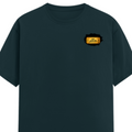 Male Classic Crew T-Shirt | Men's Regular Fit | 180 GSM Bio-Washed Cotton | Pre-Shrunk, Double-Stitched | Personalized | Typography | Bollywood | Movies | Everyday | Confident | Famous By - left pocket - Petrol Blue - mockup 3