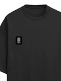 Terry Oversized Tee | Unisex Adult | 260 GSM Terry Cotton Blend | Embroidered | Ultra-Soft & Breathable | Typographic | Determination | Everyday - left pocket - Black - mockup 3