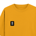 Oversized Classic T-Shirt | Unisex Fit | 100% Super-Combed Cotton | Pre-Shrunk, Double-Stitched | Adults | Typographic | Determination | Everyday - left pocket - Golden Yellow - mockup 3
