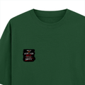 Oversized Classic T-Shirt | Unisex Oversized Fit | 100% Super-Combed Cotton | Pre-Shrunk & Ribbed Neck | Adults | Personalized | DTG | Grunge | Coffee | Pop Culture (Bollywood) | Everyday | Playful | Uri: The Surgical Strike - left pocket - Bottle Green - mockup 3