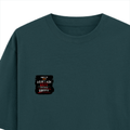 Oversized Classic T-Shirt | Unisex Oversized Fit | 100% Super-Combed Cotton | Pre-Shrunk & Ribbed Neck | Adults | Personalized | DTG | Grunge | Coffee | Pop Culture (Bollywood) | Everyday | Playful | Uri: The Surgical Strike - left pocket - Petrol Blue - mockup 3